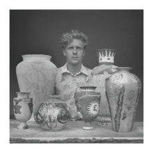Black and white photograph of Sir Grayson Perry with pots. London 1988